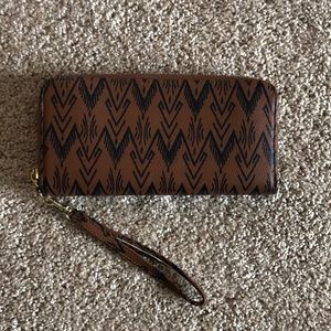 Brown leather wristlet wallet with boho design
